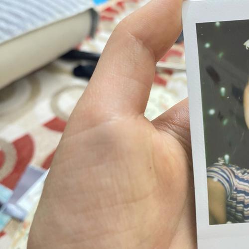 在翻拍照片时,怎样避拍出的照片上有白点?